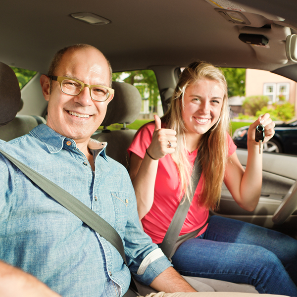 teen driver with driving instructor