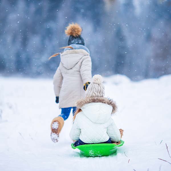 two children sledding