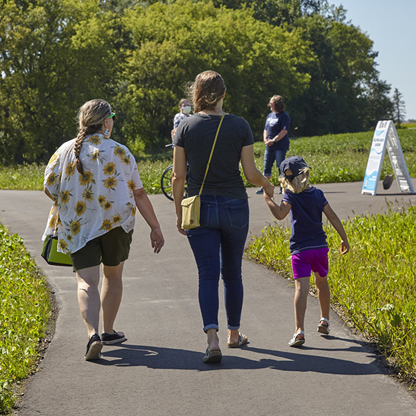 women with child walking the Prairie Trail