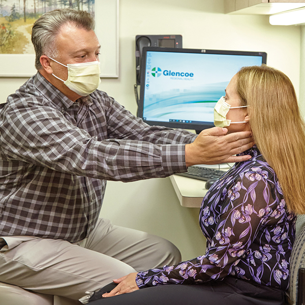 woman getting examined by doctor