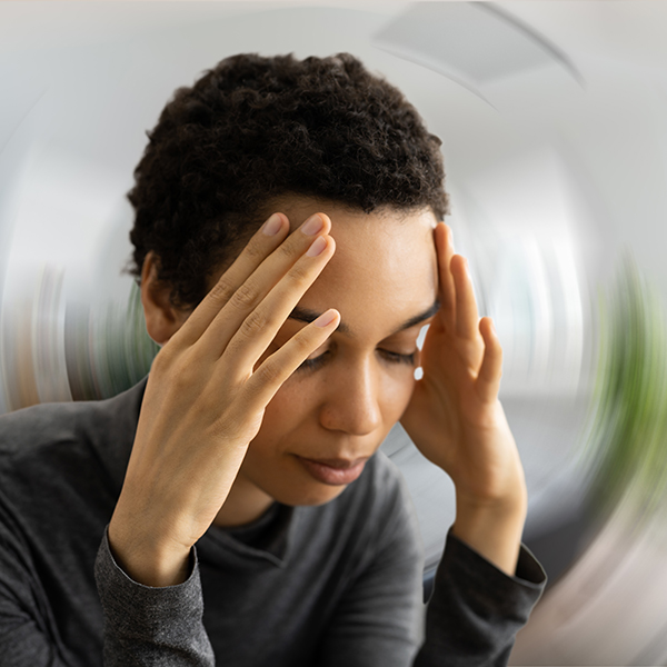 woman experiencing vertigo