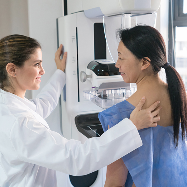 woman getting first mammogram