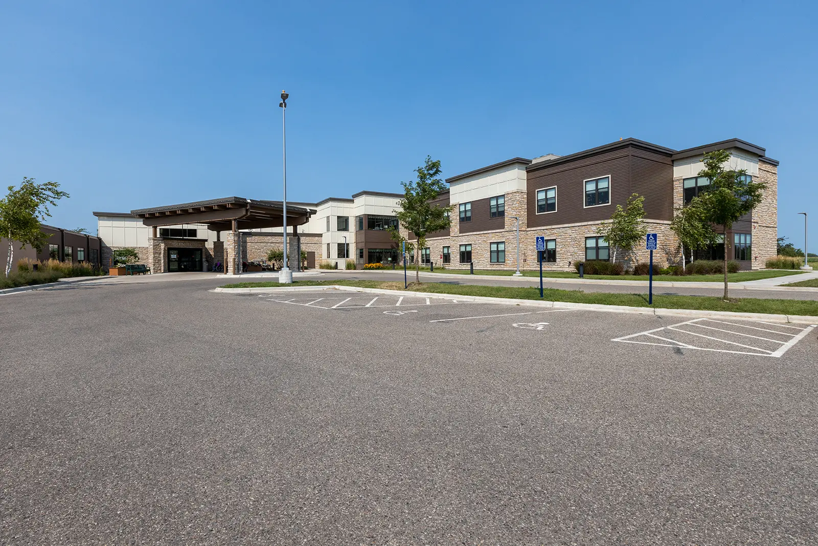 exterior view of glenfields living with care building and parking lot