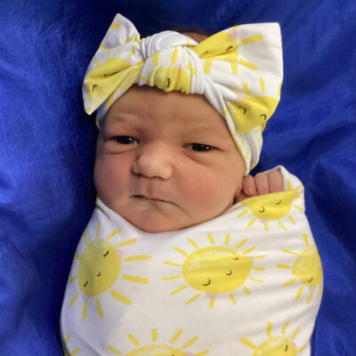 newborn baby in sunshine blanket