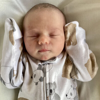 newborn baby with Kuala onesie