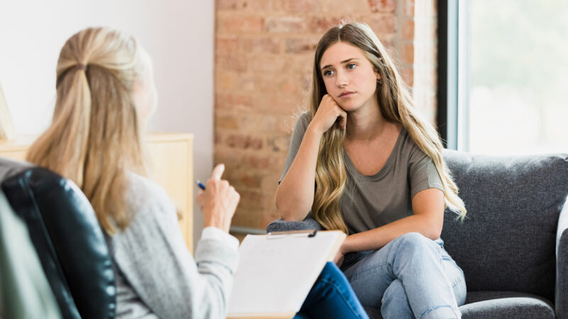 young woman chatting to therapist