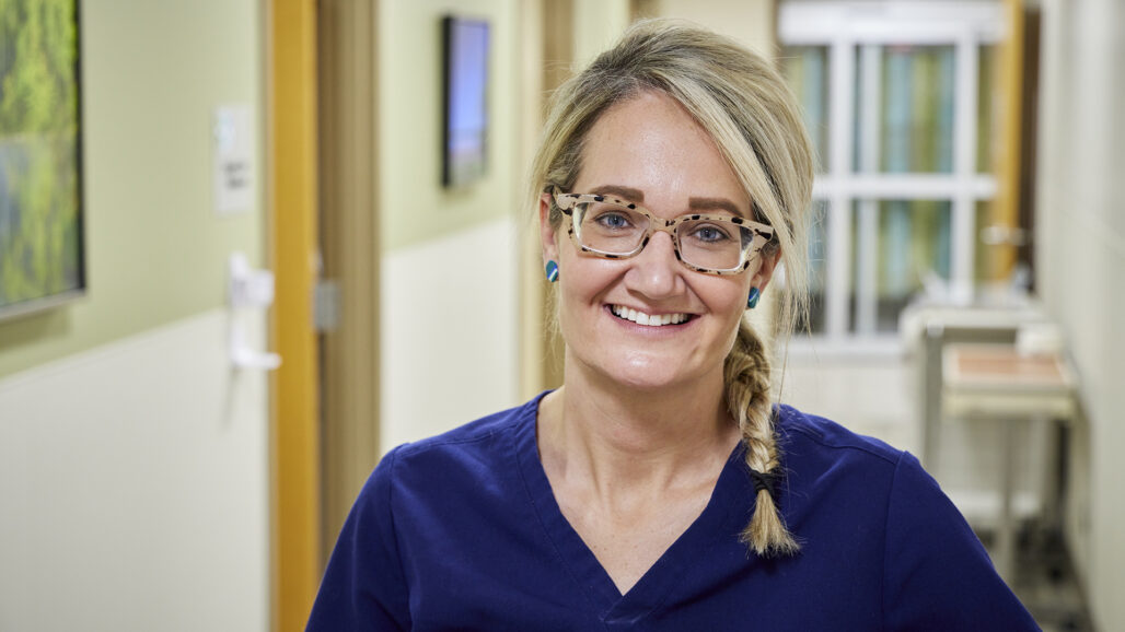 blonde woman with glasses