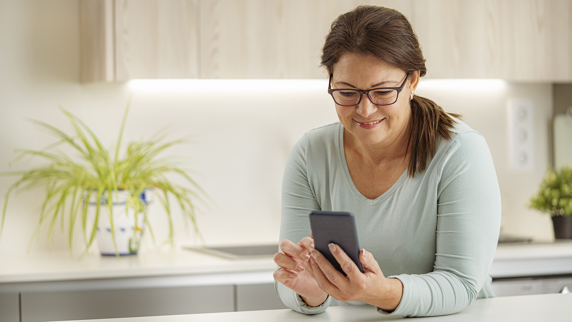 woman looking at her phone