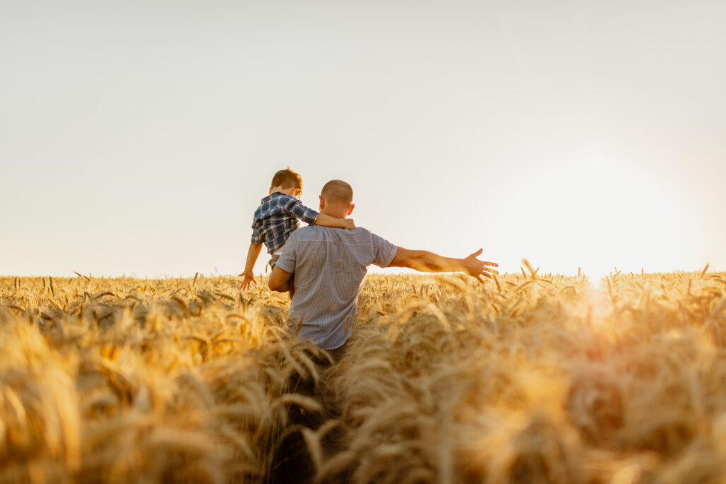 Father and son in a wheat field