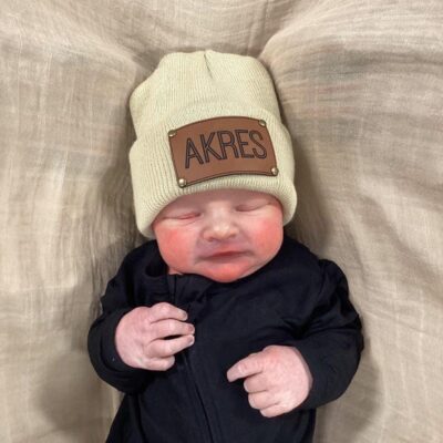 Baby wearing an Akres beanie